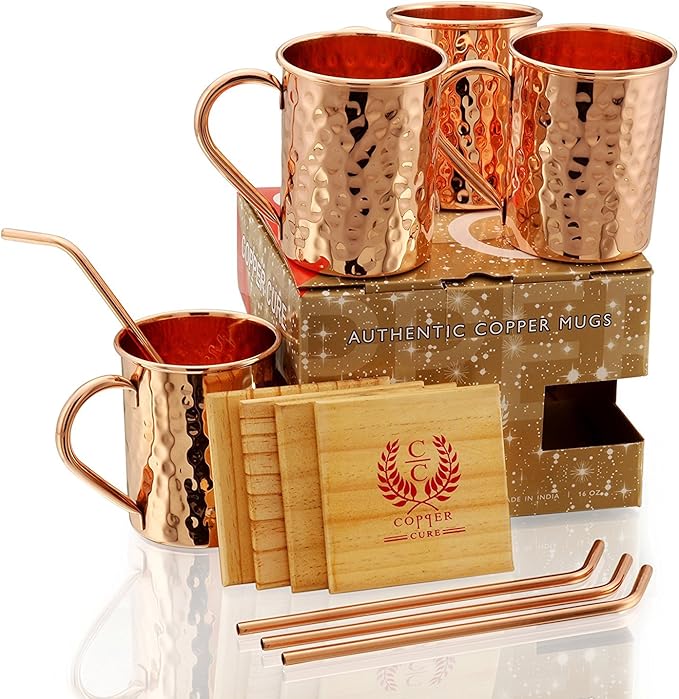 Gift Set Pure Copper Hammered Mugs with Copper Straws & Wooden Coasters Set of 4 - PREMIUM QUALITY -16 Oz Copper Mug - 100% Handcrafted - A Gift Pack for your loved Ones.